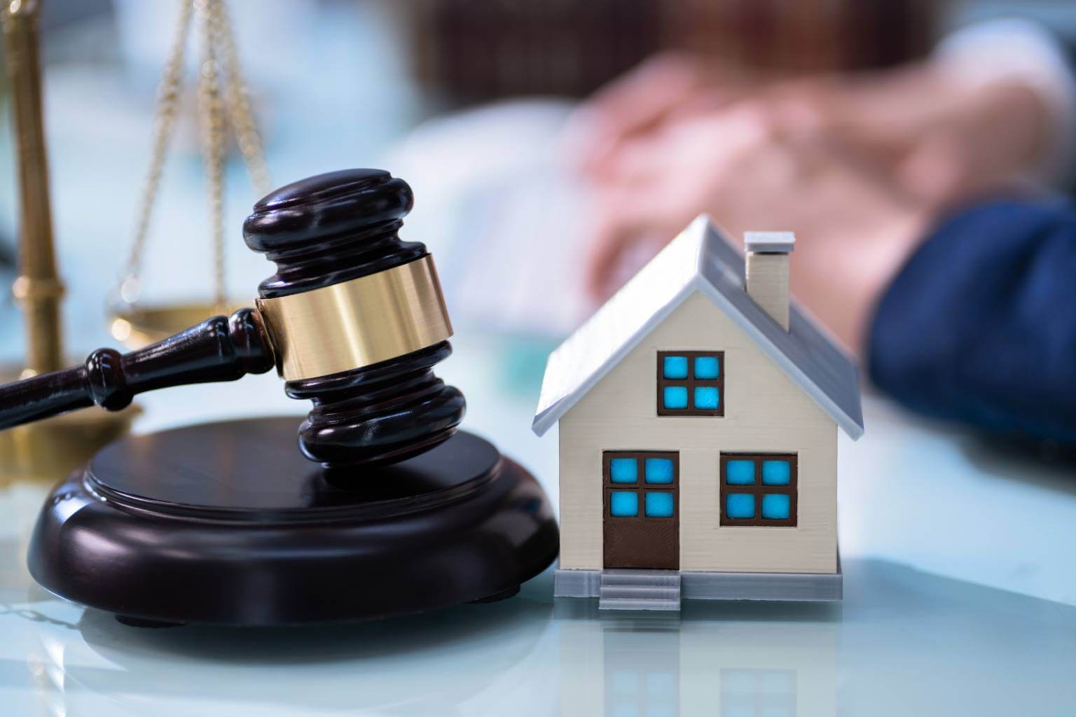 Gavel and house model symbolizing quirky homeownership laws and facts