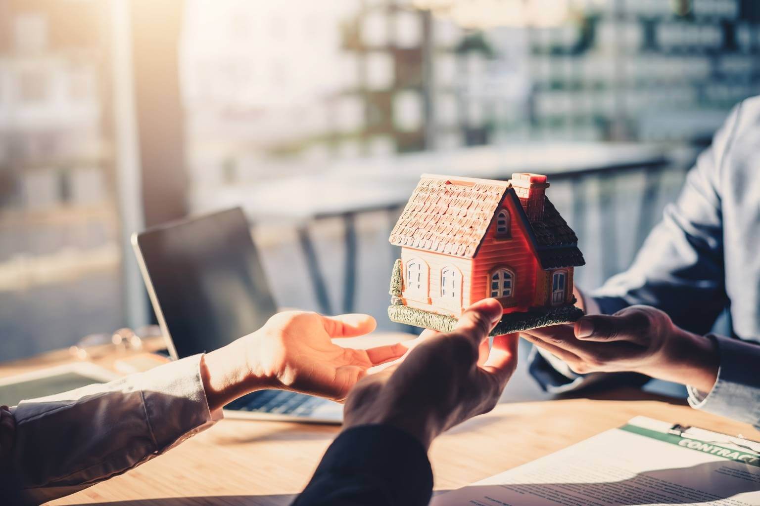 partners reviewing house purchase agreement