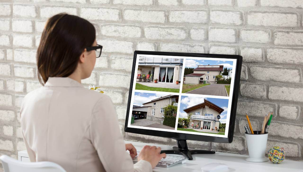 homebuyer researching duplex properties online