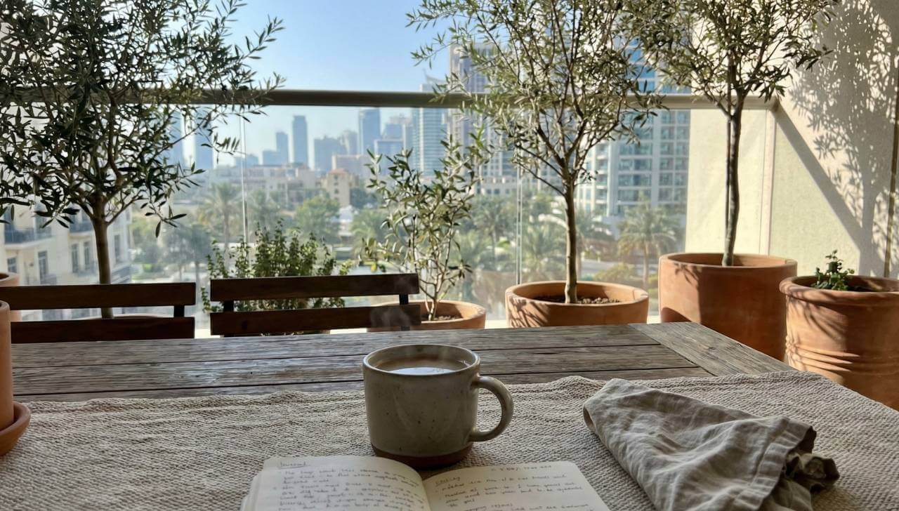relaxing view from condo balcony with coffee and city skyline