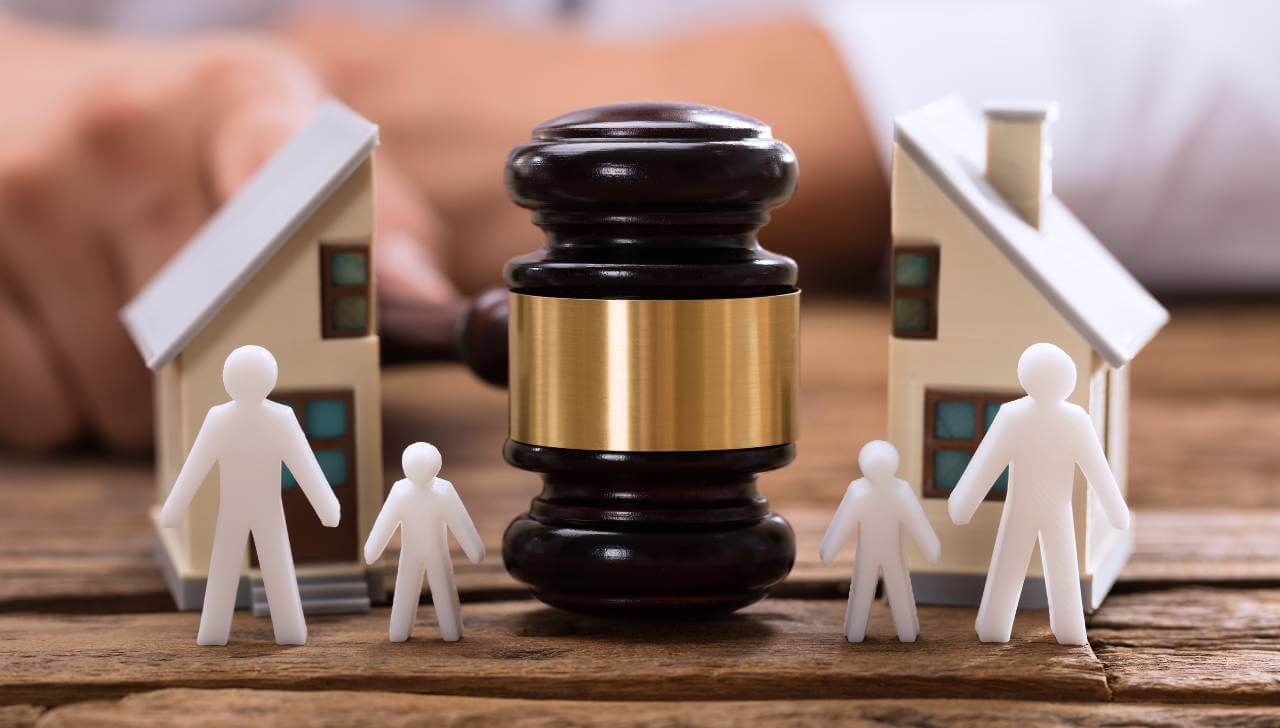 divorce mortgage decision with gavel and house figures