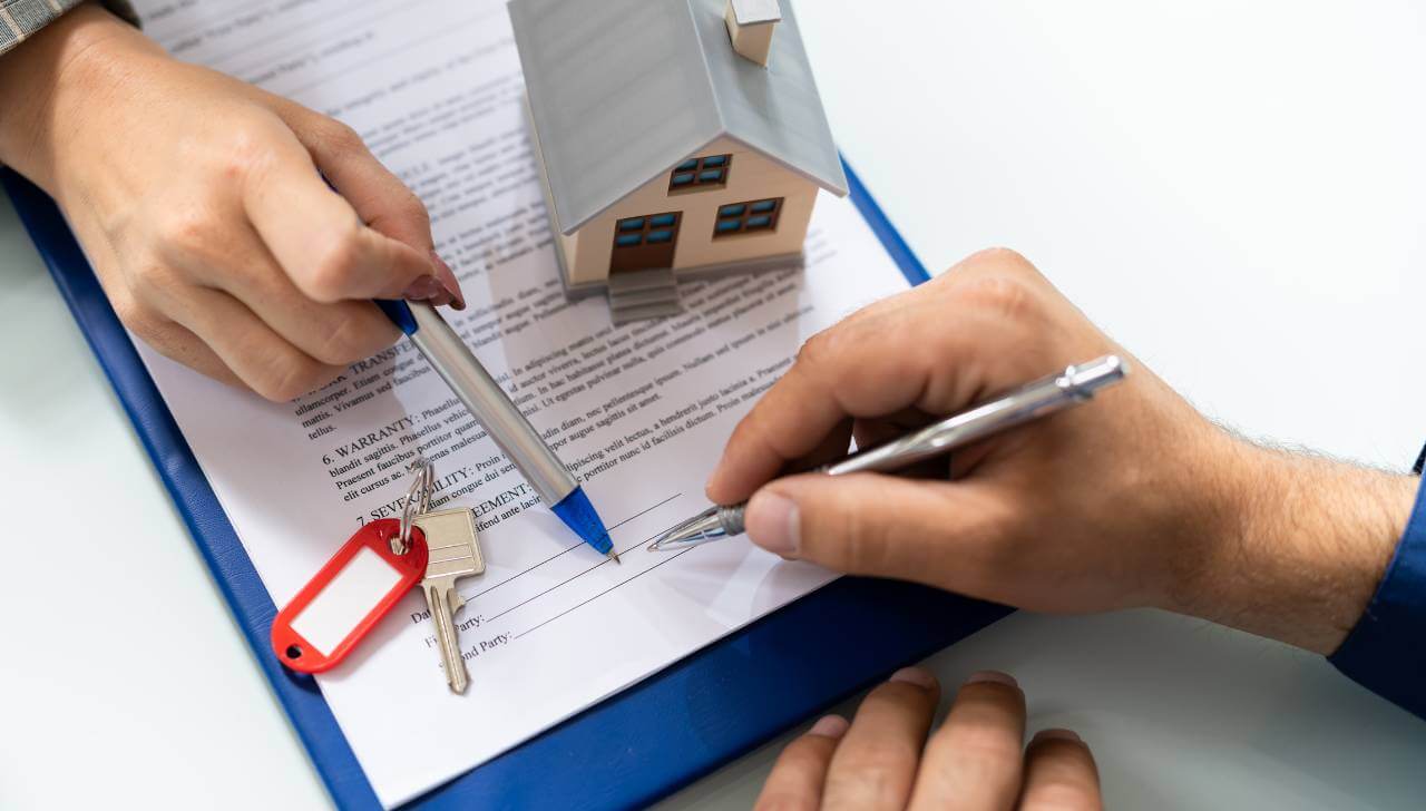 warranty deed paperwork at closing