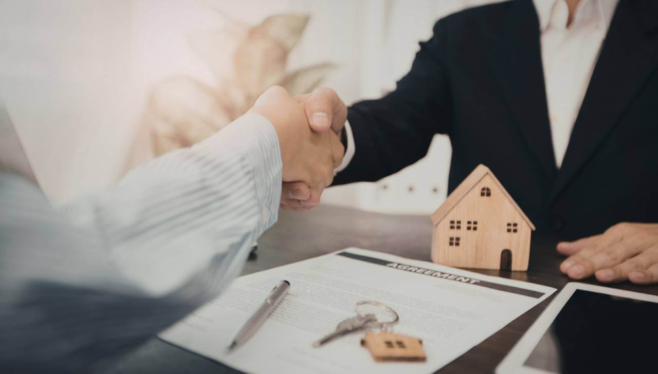 real estate scam deal handshake